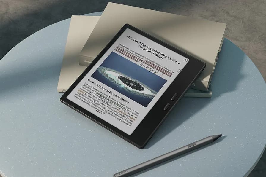 A BOOX Go Color 7 Gen II on a side table showing a color photo, with its stylus