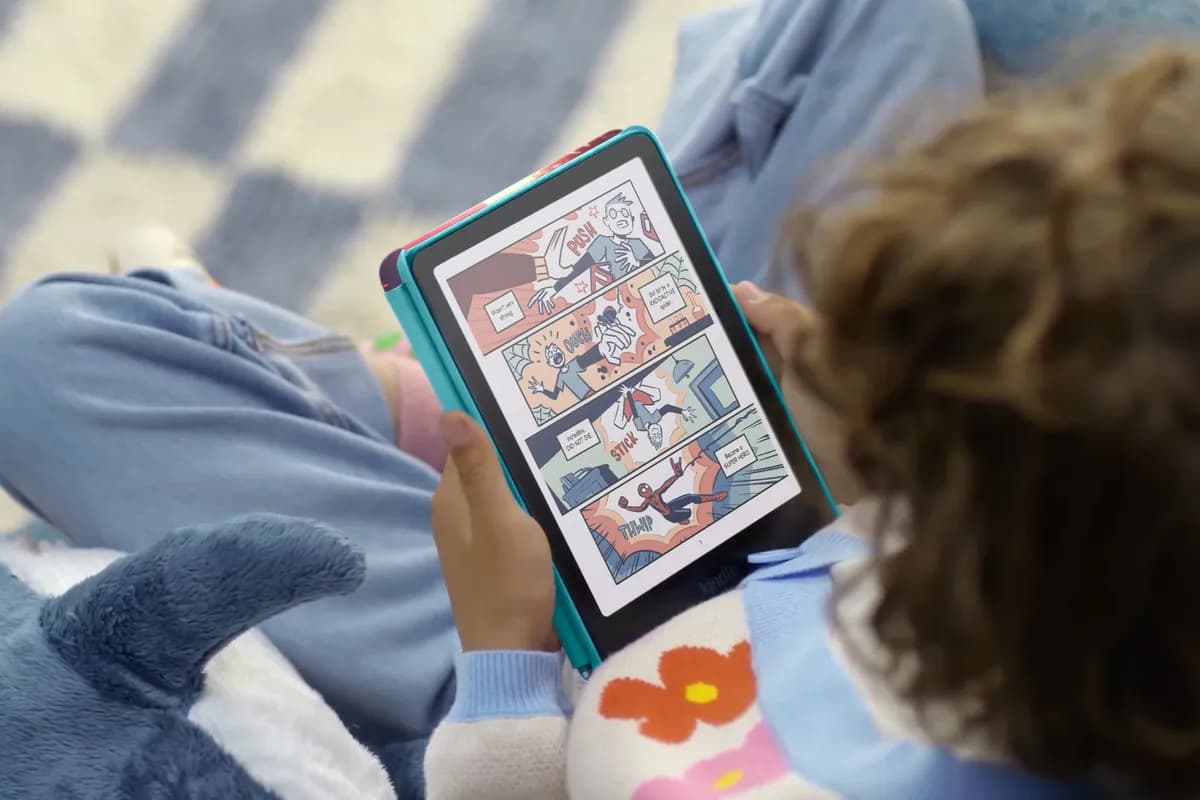 A child reading a color comic on a Kindle Colorsoft Kids