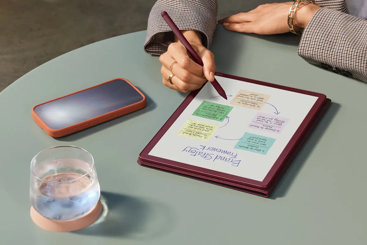 A hand drawing a color-coded diagram on a Kindle Scribe Colorsoft with its pen